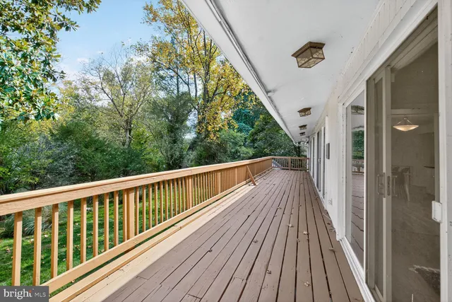 a view of balcony with wooden floor