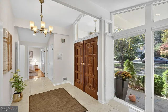 a view of a hallway with a chandelier