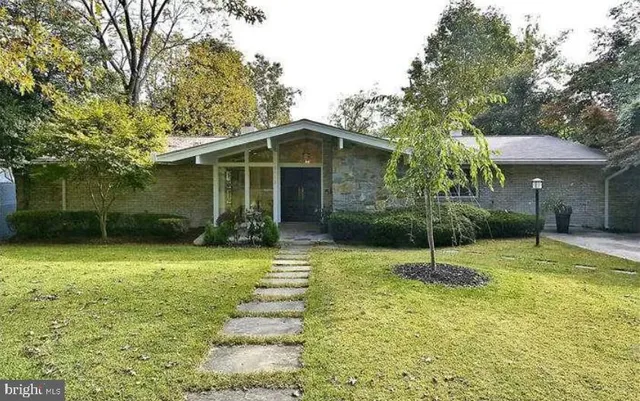 a backyard of a house with lots of green space