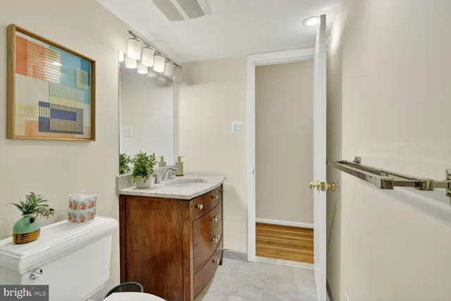 a bathroom with a sink vanity tub and shower