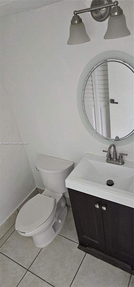 8372 Southwest 23rd Court Miramar, FL 33025 - Photo 14 of 22 a bathroom with a sink mirror and toilet