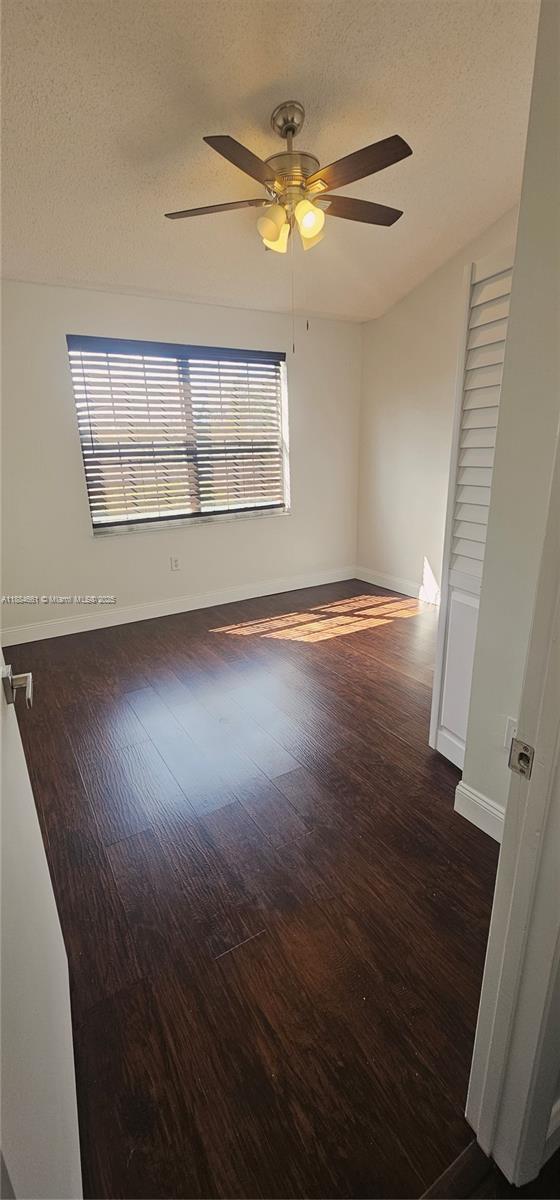 8372 Southwest 23rd Court Miramar, FL 33025 - Photo 15 of 22 wooden floor in an empty room with a window