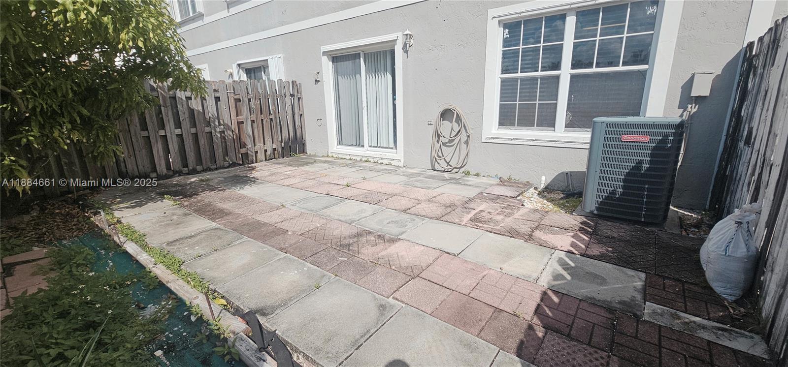 8372 Southwest 23rd Court Miramar, FL 33025 - Photo 20 of 22 a front view of a house with a yard