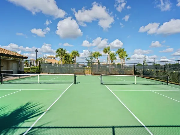 a view of an outdoor space and tennis court