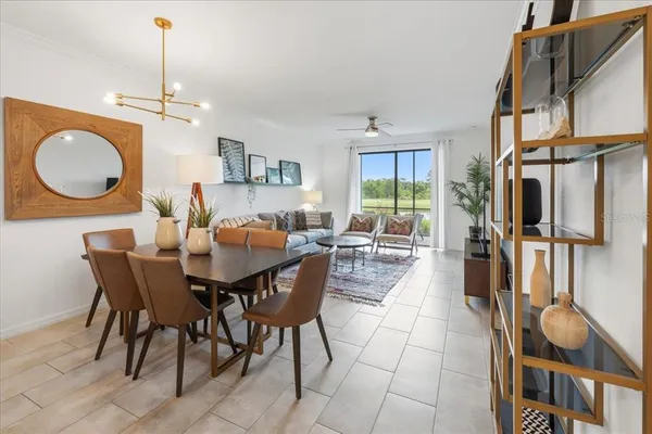 a dining room with furniture and window