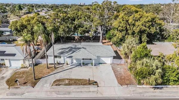 aerial view of a house with yard and staircase