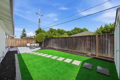 a view of a backyard with a garden