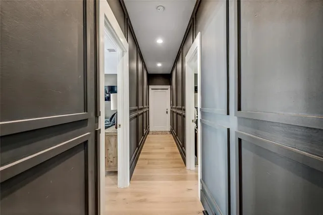 a spacious bedroom with a large bed and a large window