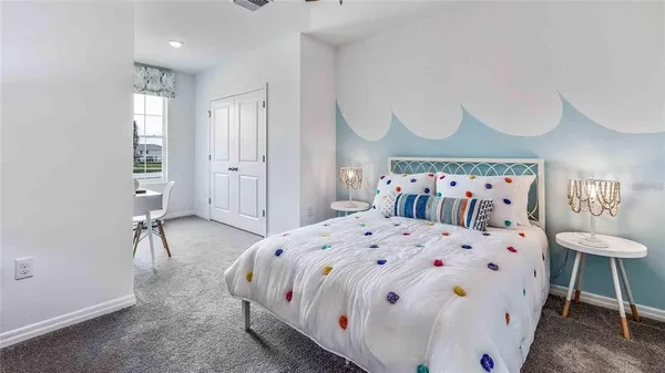 a large white bed in a white room