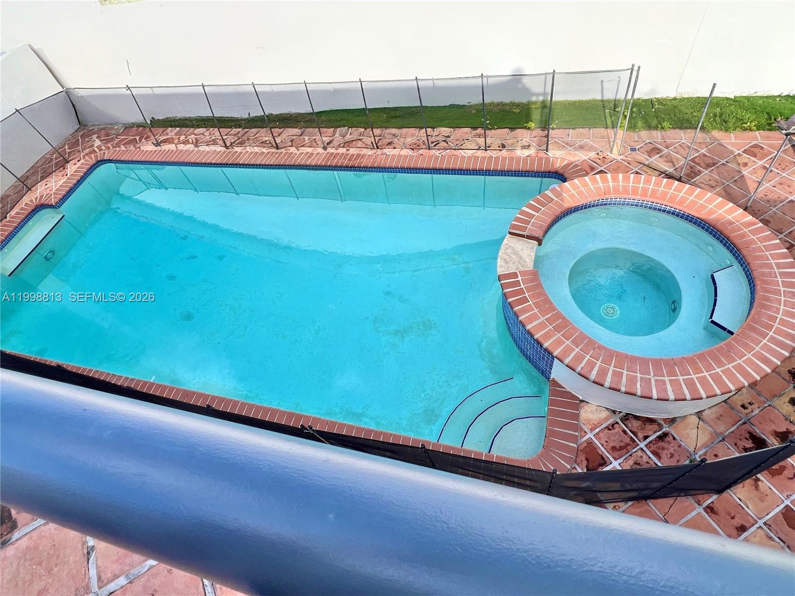 10140 Southwest 26th Terrace Miami, FL 33165 - Photo 21 of 70 a view of a swimming pool and outdoor space