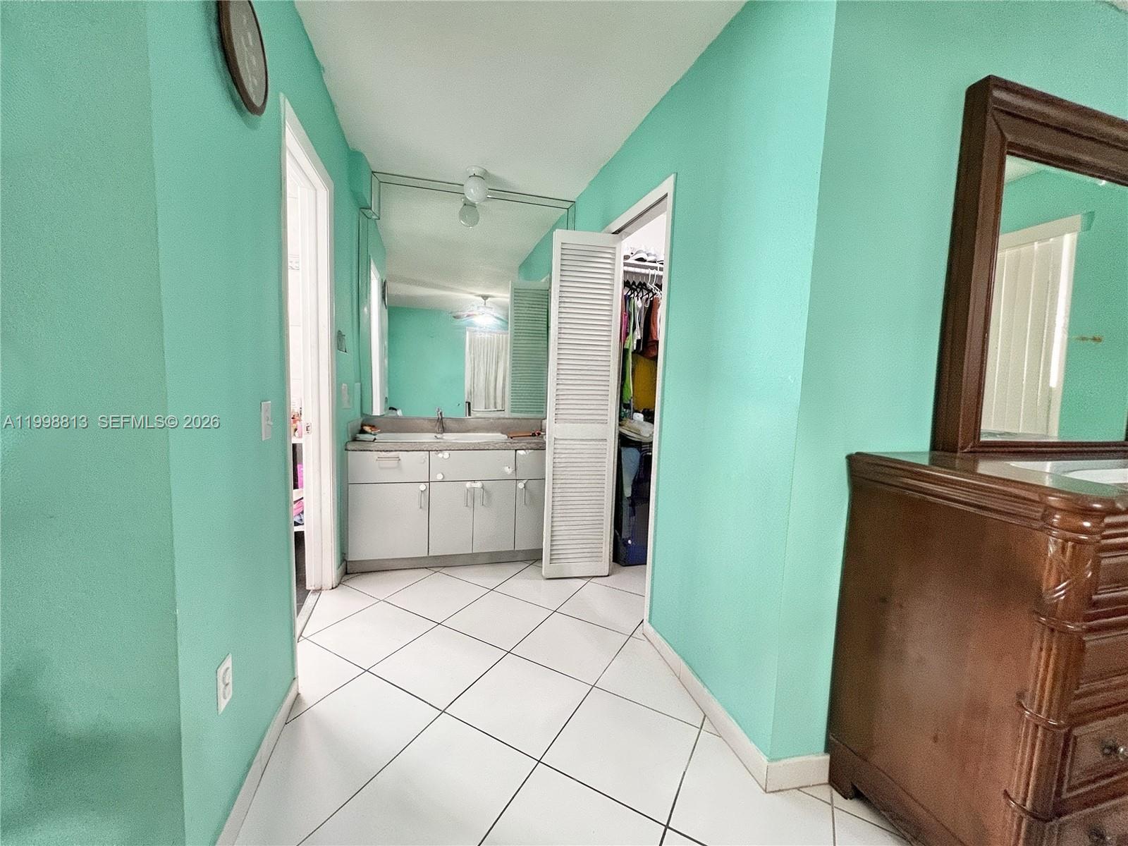 10140 Southwest 26th Terrace Miami, FL 33165 - Photo 27 of 70 a bathroom with a sink a toilet and a mirror