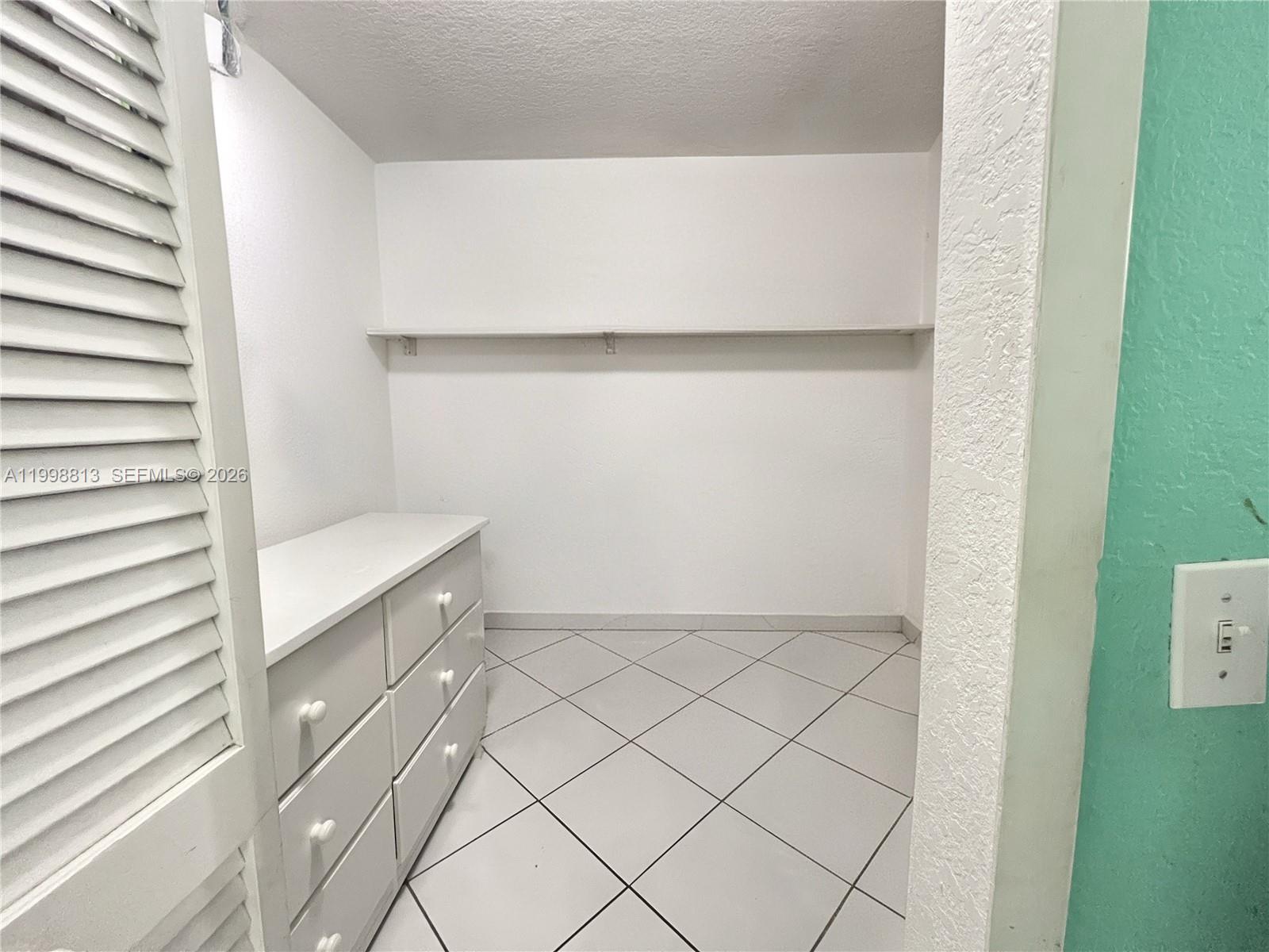 10140 Southwest 26th Terrace Miami, FL 33165 - Photo 28 of 70 a view of an empty walk in closet