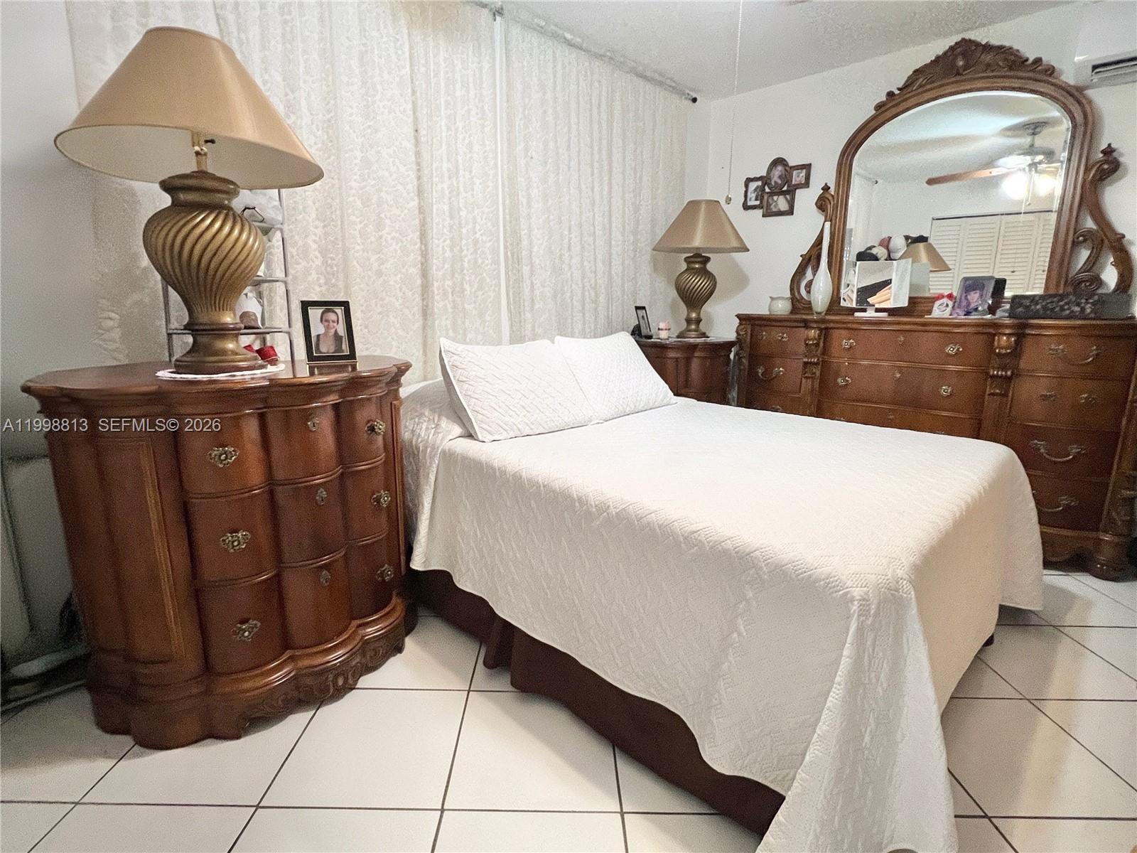 10140 Southwest 26th Terrace Miami, FL 33165 - Photo 40 of 70 a bed room with a bed and a mirror