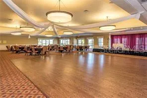 a lobby with furniture and a chandelier