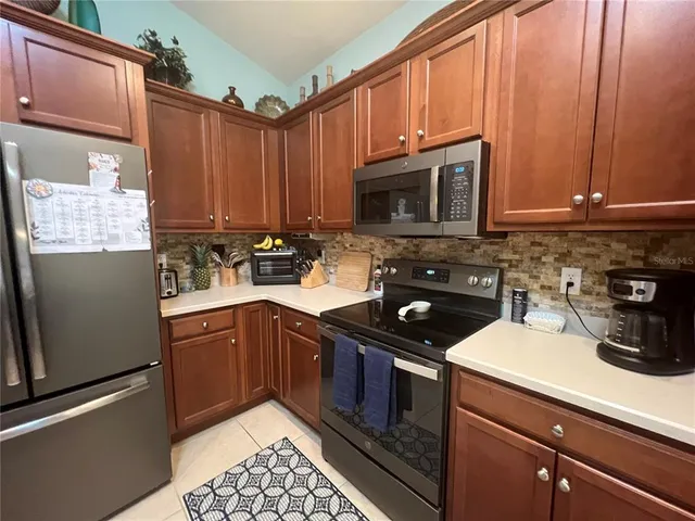 a kitchen with a sink stove and microwave