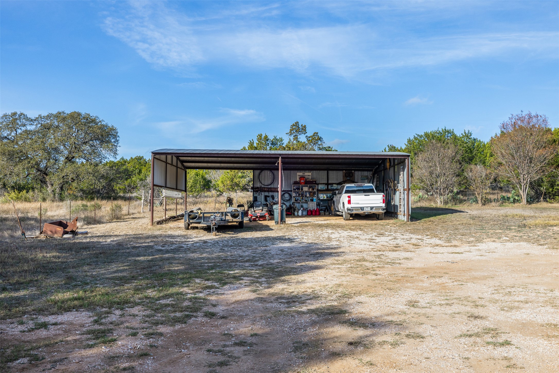 27701 Turner Ranch Road Marble Falls, TX 78654 - Photo 40 of 40 View of pole building with a carport and driveway