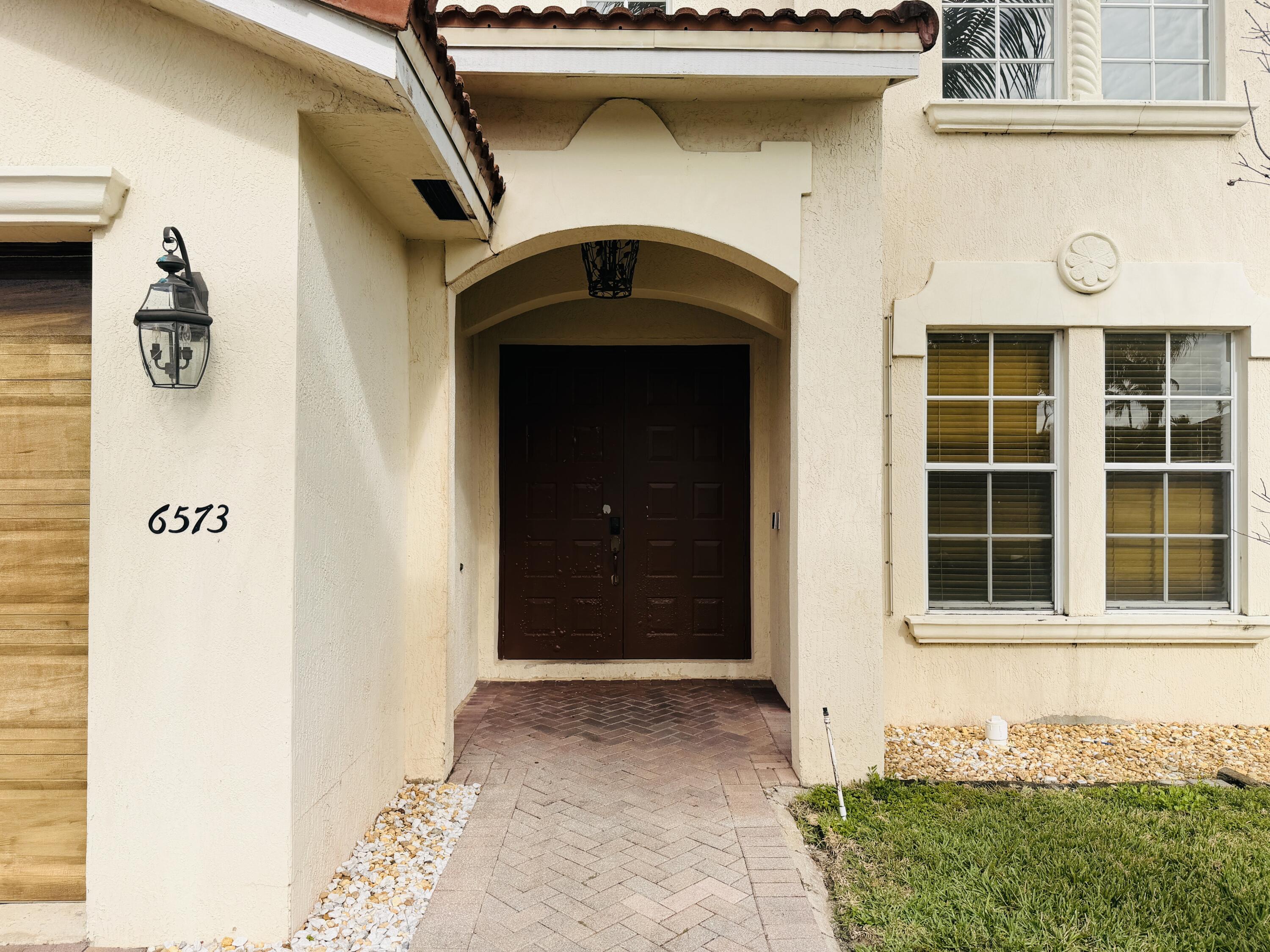 6573 Traveler Road West Palm Beach, FL 33411 - Photo 2 of 25 Front of the Home