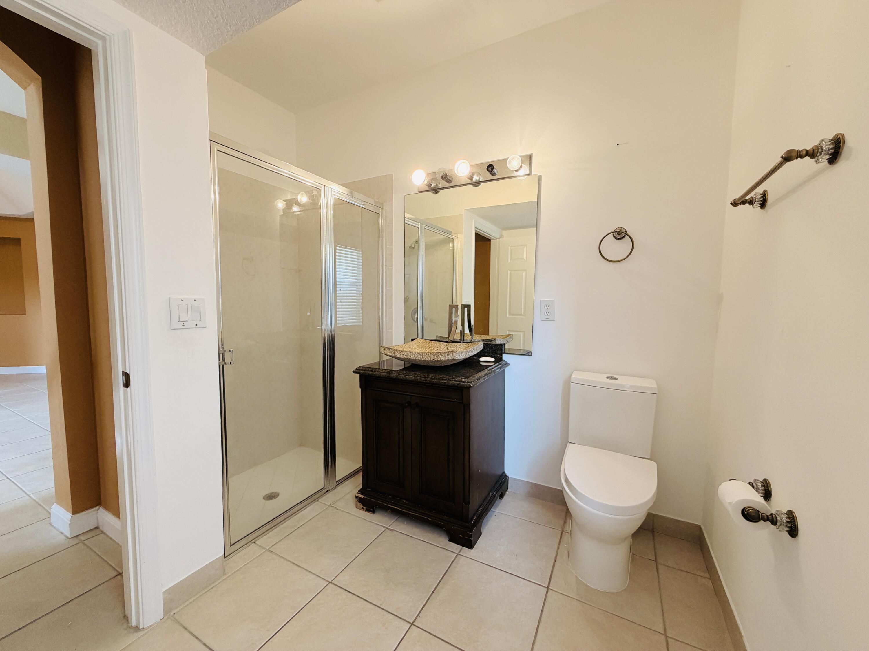 6573 Traveler Road West Palm Beach, FL 33411 - Photo 9 of 25 Downstairs Restroom