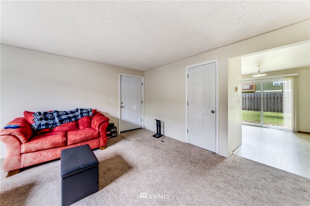 3901 Mason Loop Road, Unit AD Tacoma, WA 98409 - Photo 11 of 20 a living room with furniture and a couch