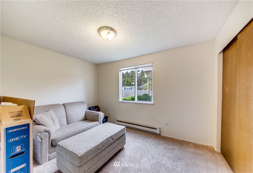 3901 Mason Loop Road, Unit AD Tacoma, WA 98409 - Photo 15 of 20 a living room with furniture and a window