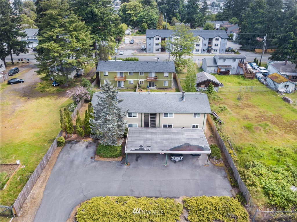 3901 Mason Loop Road, Unit AD Tacoma, WA 98409 - Photo 3 of 20 a view of a house with a ocean view