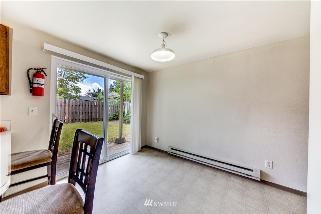 3901 Mason Loop Road, Unit AD Tacoma, WA 98409 - Photo 8 of 20 a view of an entryway with wooden floor