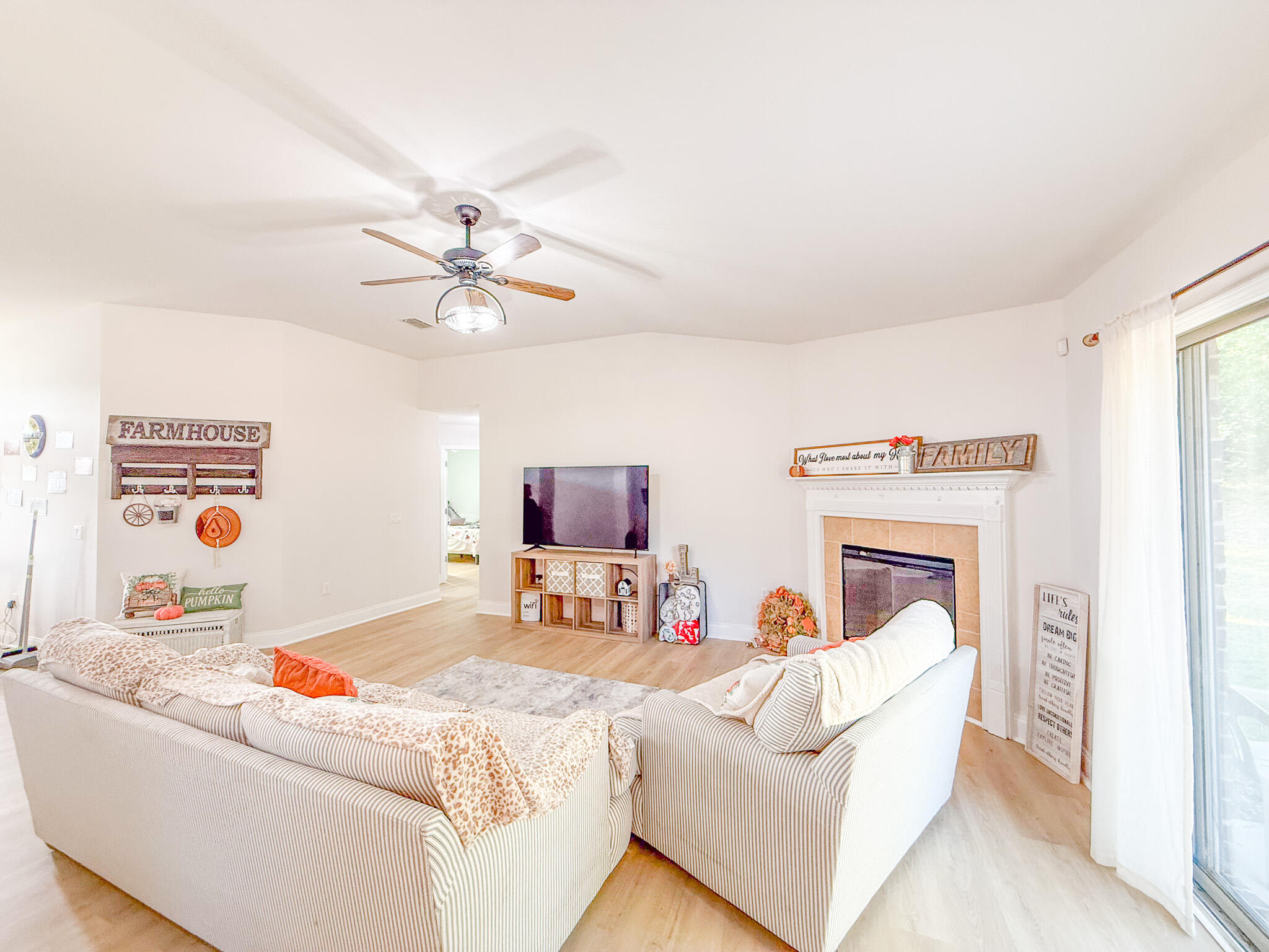 6214 Flash Lane Crestview, FL 32536 - Photo 19 of 42 a living room with furniture and a fireplace