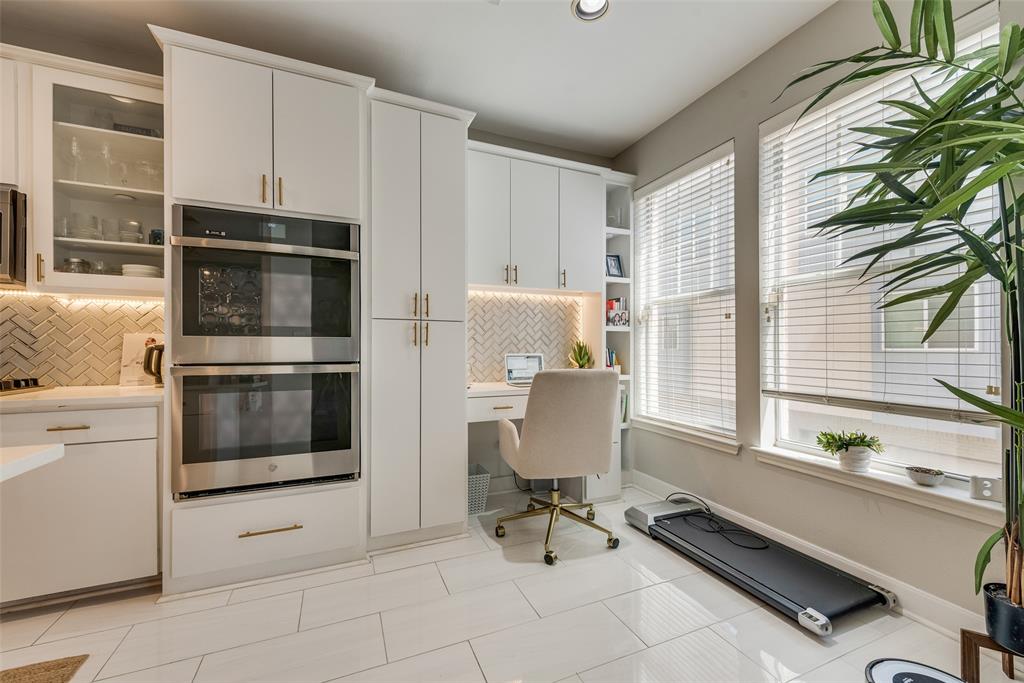 4904 Live Oak Street, Unit 302 Dallas, TX 75206 - Photo 15 of 25 a kitchen with a stove a microwave and cabinets