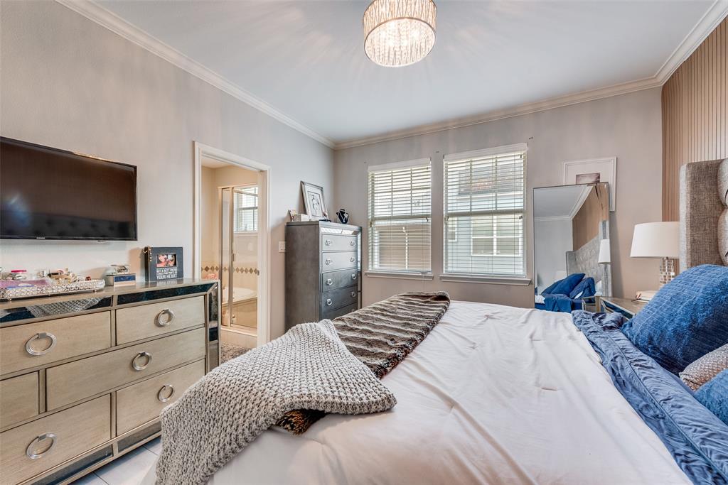 4904 Live Oak Street, Unit 302 Dallas, TX 75206 - Photo 18 of 25 a bedroom with a bed and a flat screen tv