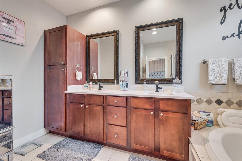 4904 Live Oak Street, Unit 302 Dallas, TX 75206 - Photo 20 of 25 a bathroom with a double vanity sink and a mirror
