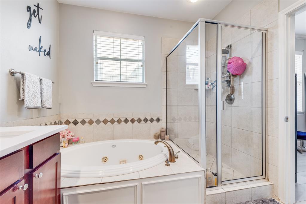 4904 Live Oak Street, Unit 302 Dallas, TX 75206 - Photo 21 of 25 a bathroom with a bathtub and a shower