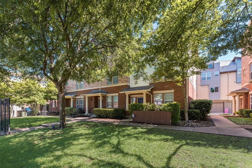 4904 Live Oak Street, Unit 302 Dallas, TX 75206 - Photo 23 of 25 a front view of a house with a yard and green space
