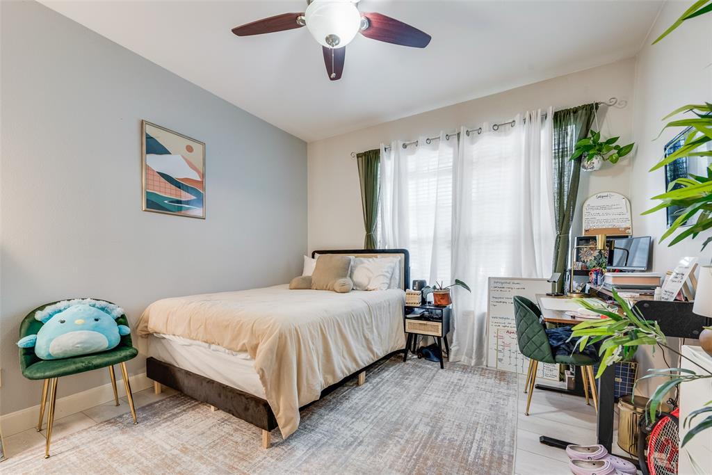 4904 Live Oak Street, Unit 302 Dallas, TX 75206 - Photo 3 of 25 a bedroom with a bed and a chandelier