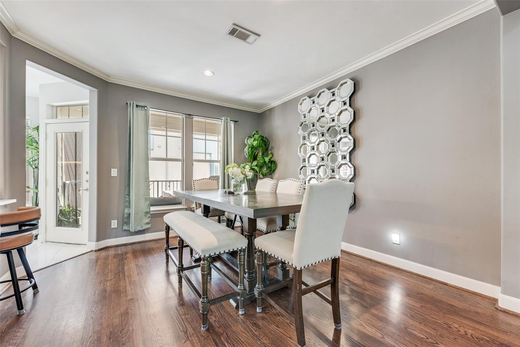 4904 Live Oak Street, Unit 302 Dallas, TX 75206 - Photo 7 of 25 a view of a dining room with furniture window and wooden floor