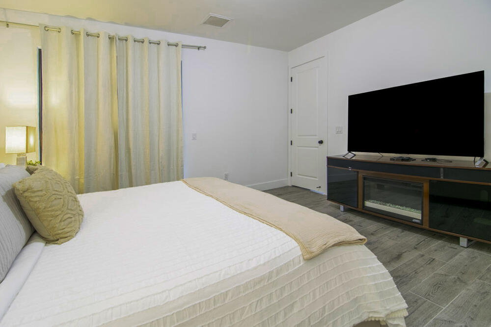 15245 Brainbridge Circle Port Charlotte, FL 33981 - Photo 14 of 52 a bedroom with a bed and a flat screen tv