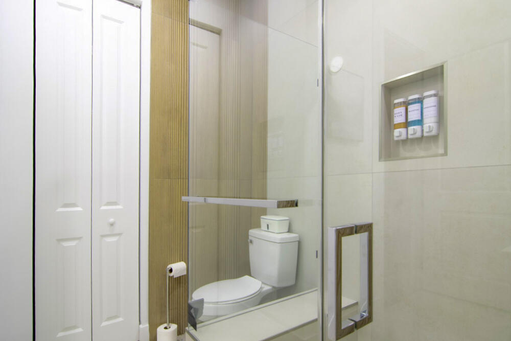 15245 Brainbridge Circle Port Charlotte, FL 33981 - Photo 17 of 52 a white toilet sitting next to a bathroom sink