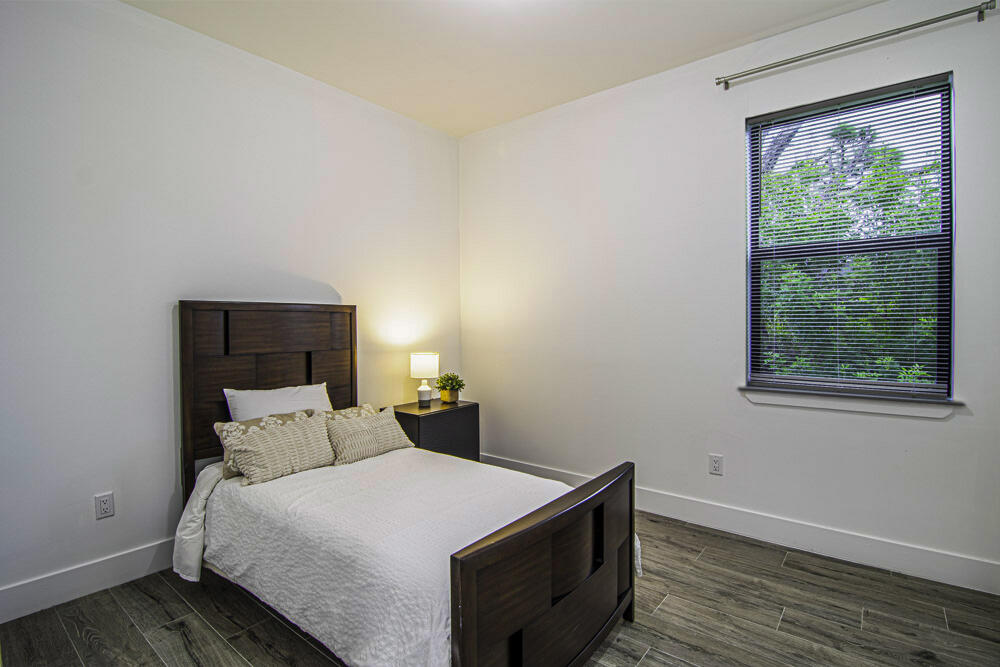 15245 Brainbridge Circle Port Charlotte, FL 33981 - Photo 18 of 52 a bedroom with a bed and window