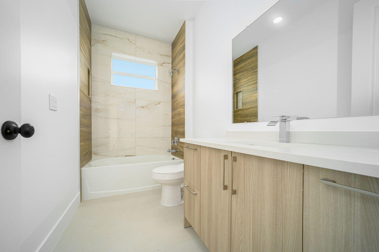 15245 Brainbridge Circle Port Charlotte, FL 33981 - Photo 30 of 52 a bathroom with a sink a toilet and shower