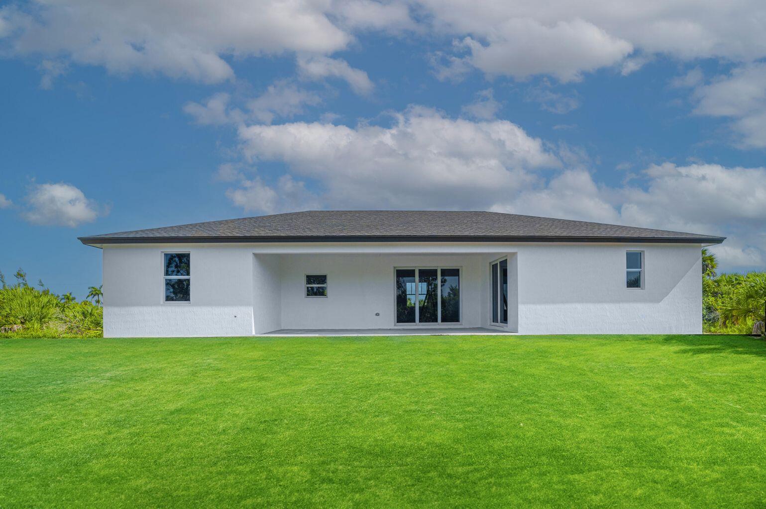 15245 Brainbridge Circle Port Charlotte, FL 33981 - Photo 40 of 52 a house view with a garden space