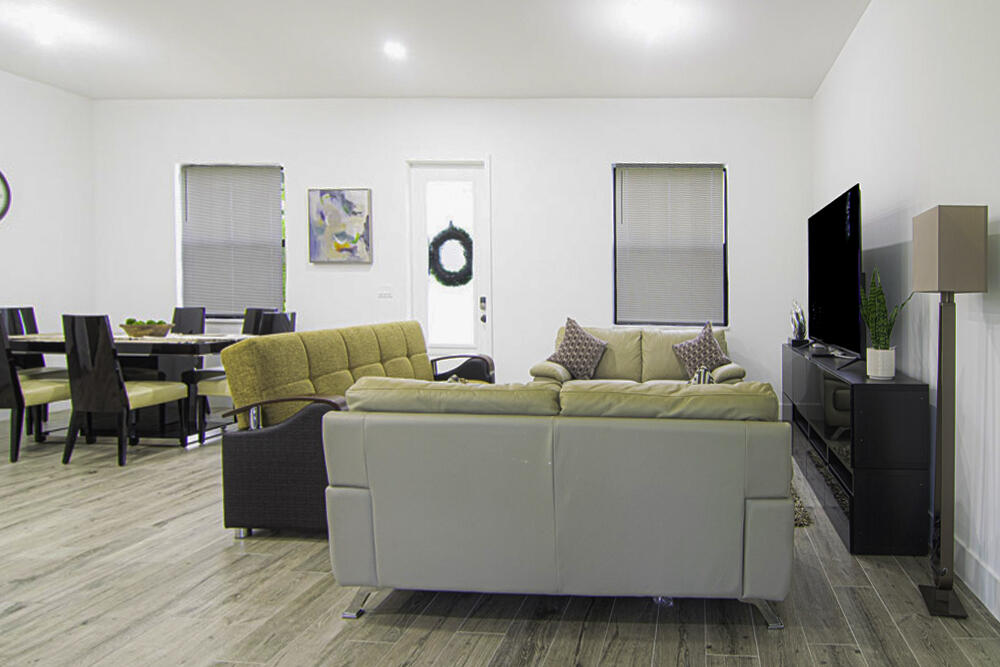 15245 Brainbridge Circle Port Charlotte, FL 33981 - Photo 5 of 52 a living room with furniture and a flat screen tv