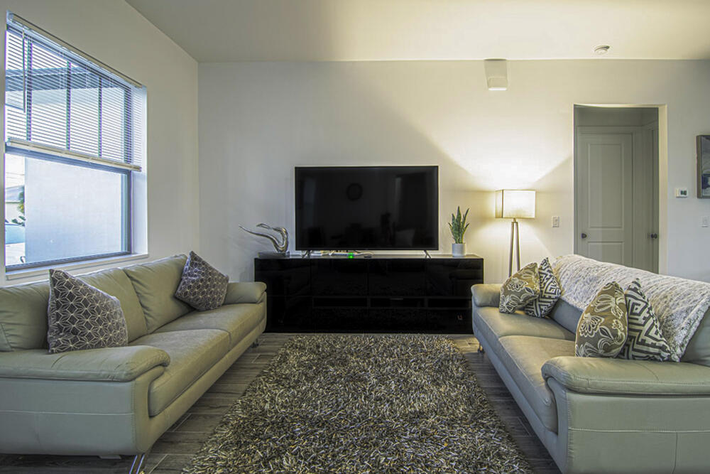 15245 Brainbridge Circle Port Charlotte, FL 33981 - Photo 7 of 52 a living room with furniture and a flat screen tv
