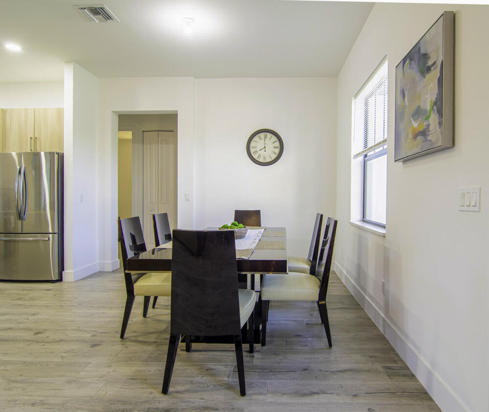 15245 Brainbridge Circle Port Charlotte, FL 33981 - Photo 9 of 52 a view of a dining room with furniture window and wooden floor