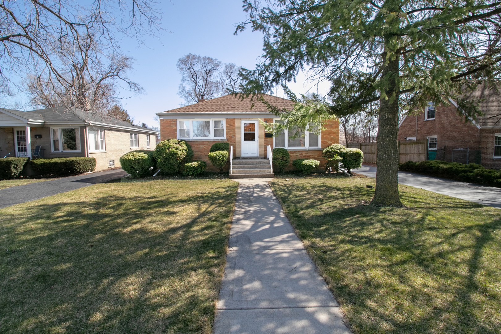215 Iroquois Road Hillside, IL 60162 - Photo 1 of 26 a front view of a house with a yard