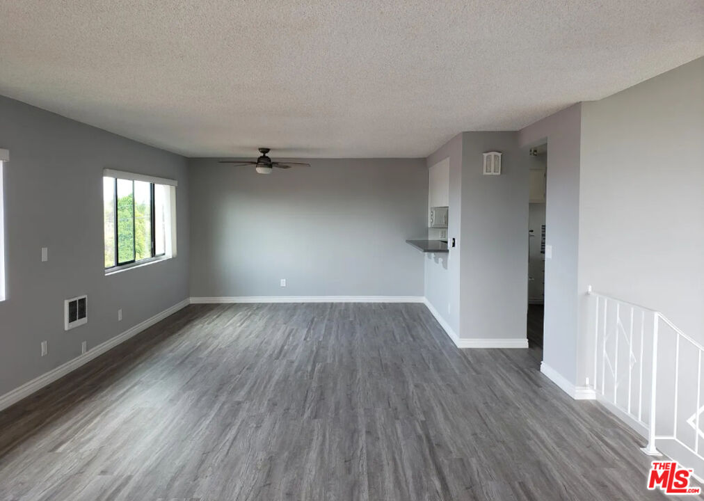 7 Clipper Road Rancho Palos Verdes, CA 90275 - Photo 12 of 20 wooden floor in an empty room with a window