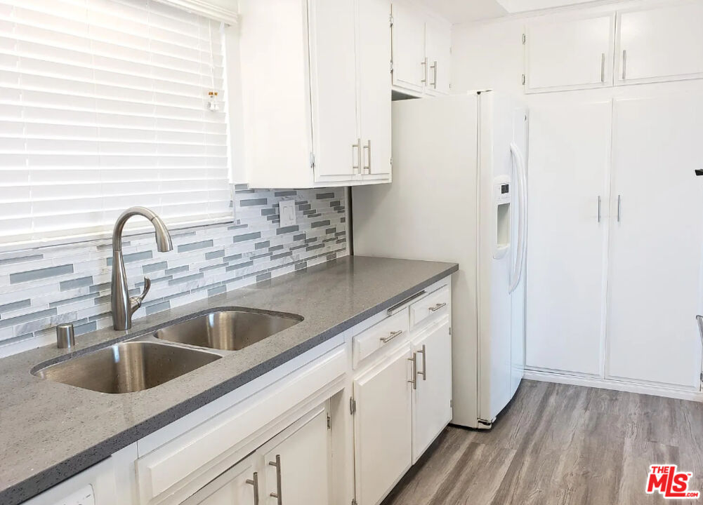 7 Clipper Road Rancho Palos Verdes, CA 90275 - Photo 15 of 20 a close view of a sink a faucet and appliance in the kitchen