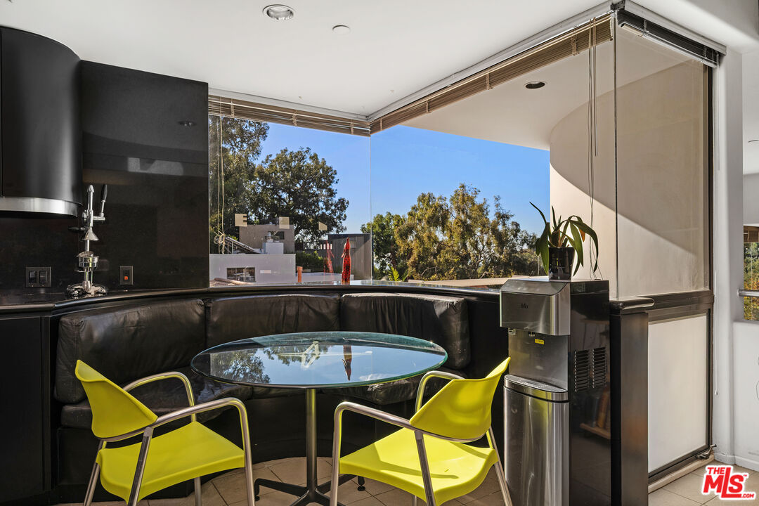 477 Upper Mesa Road Santa Monica, CA 90402 - Photo 11 of 30 a view of a chairs and table in patio