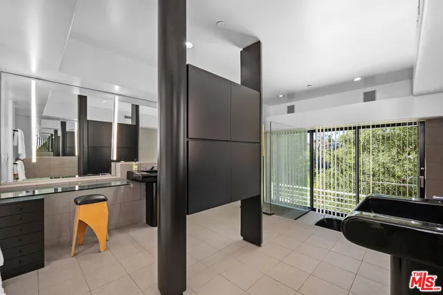 a kitchen with a refrigerator a sink and a stove