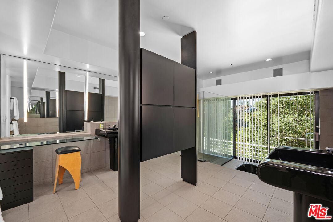 477 Upper Mesa Road Santa Monica, CA 90402 - Photo 19 of 30 a kitchen with a refrigerator a sink and a stove