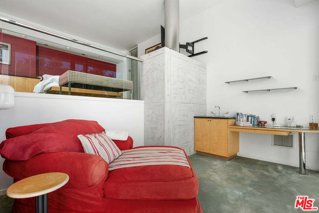 477 Upper Mesa Road Santa Monica, CA 90402 - Photo 21 of 30 a bedroom with a bed and a desk