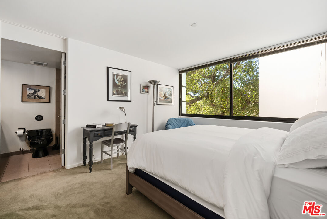477 Upper Mesa Road Santa Monica, CA 90402 - Photo 25 of 30 a bedroom with a bed and a large window